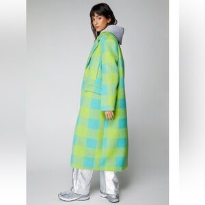 Oversized plaid coat . It’s a medium but it’s oversized . NEVER WORN .